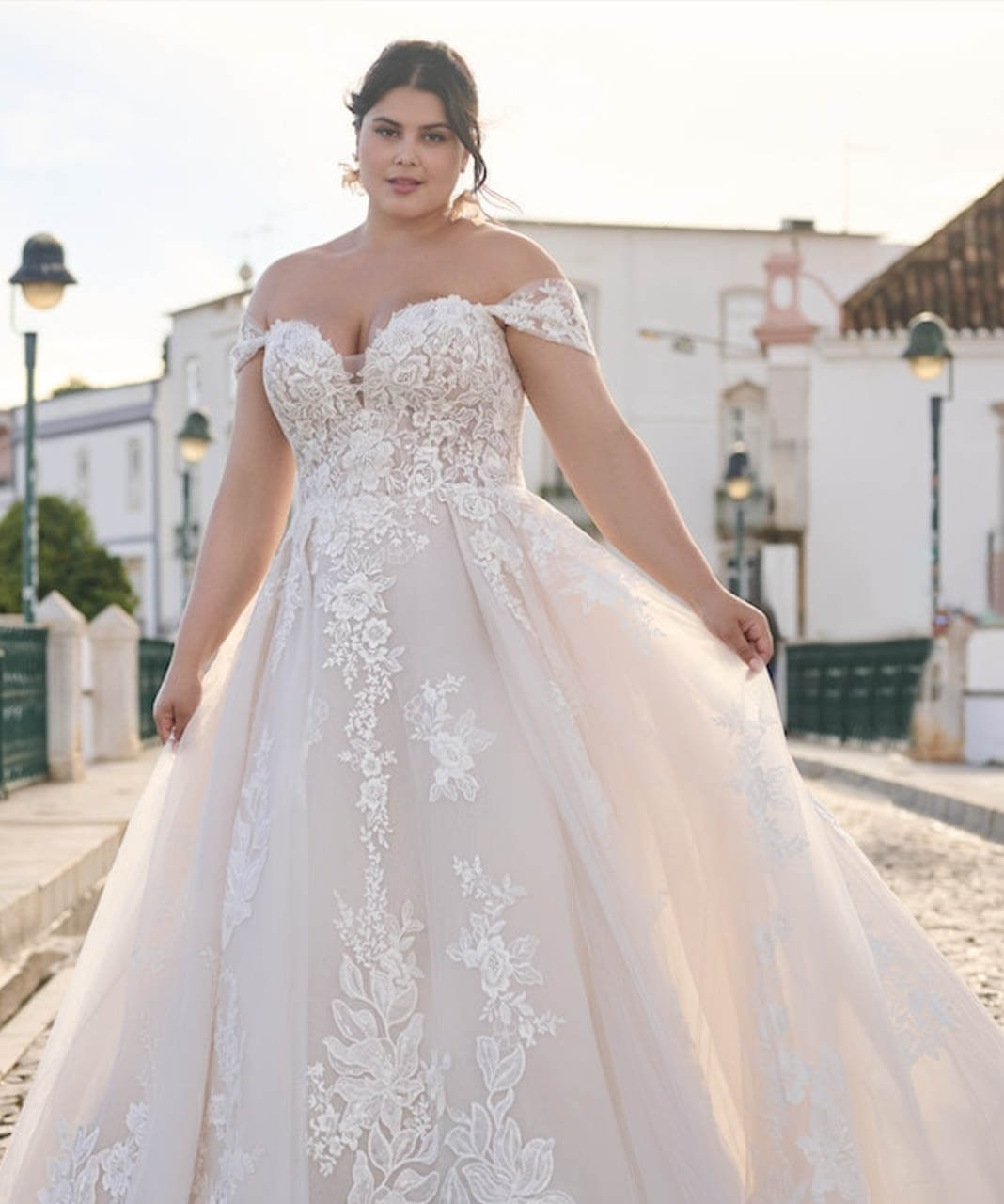 Model wearing a white bridal dress
